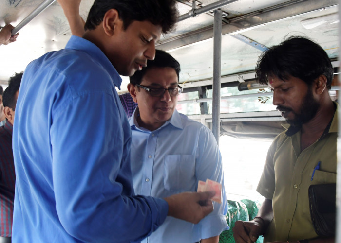 District collector and M P Joseph, IAS taking bus